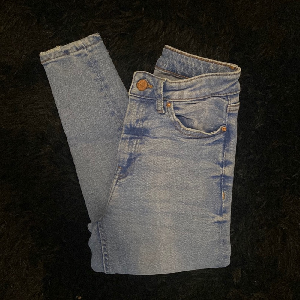 Ripped at the knee skinny jeans